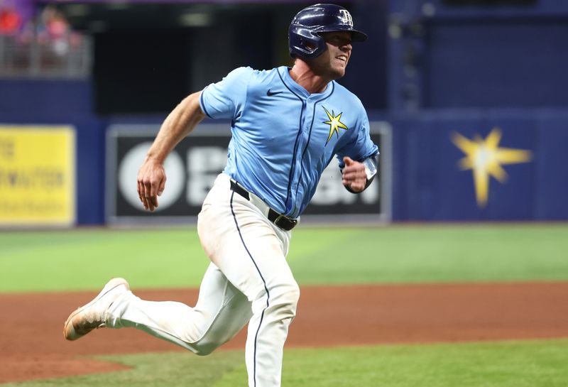 Jul 30, 2024; St. Petersburg, Florida, USA; Tampa Bay Rays catcher Ben Rortvedt (30) runs home to score a run against the Miami Marlins during the sixth inning at Tropicana Field. Mandatory Credit: Kim Klement Neitzel-USA TODAY Sports