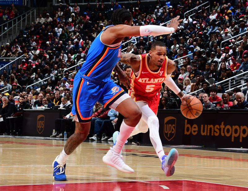 ATLANTA, GA - JANUARY 3: Dejounte Murray #5 of the Atlanta Hawks handles the ball during the game against the Oklahoma City Thunder on January 3, 2024 at State Farm Arena in Atlanta, Georgia.  NOTE TO USER: User expressly acknowledges and agrees that, by downloading and/or using this Photograph, user is consenting to the terms and conditions of the Getty Images License Agreement. Mandatory Copyright Notice: Copyright 2024 NBAE (Photo by Scott Cunningham/NBAE via Getty Images)