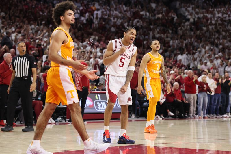 Jan 3, 2026; Fayetteville, Arkansas, USA; Arkansas Razorbacks guard Darius Acuff Jr (5) celebrates after a foul call against the Tennessee Volunteers during the second half at Bud Walton Arena.  Mandatory Credit: Nelson Chenault-Imagn Images