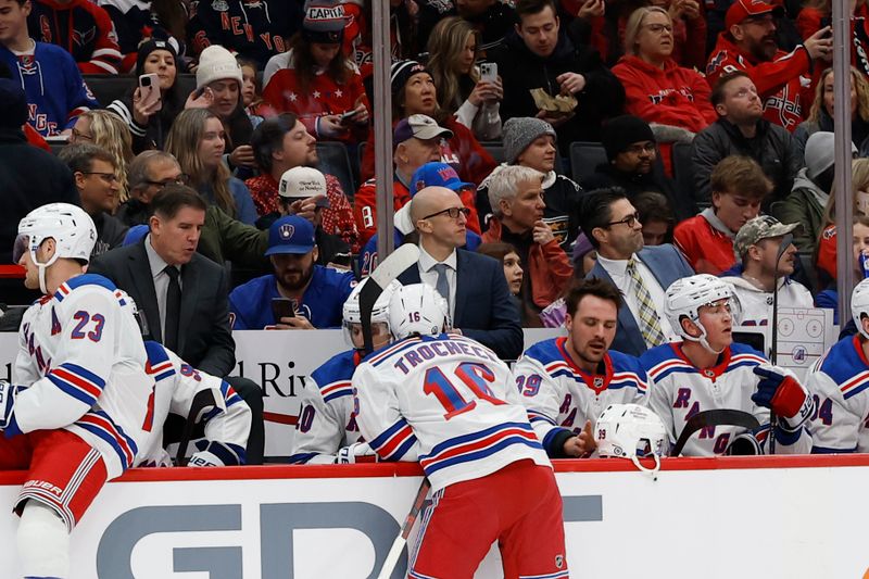 Jan 4, 2025; Washington, District of Columbia, USA; New York Rangers head coach Peter Laviolette (L) talks with Rangers center Vincent Trocheck (16) during a time against the Washington Capitals in the first period at Capital One Arena. Mandatory Credit: Geoff Burke-Imagn Images