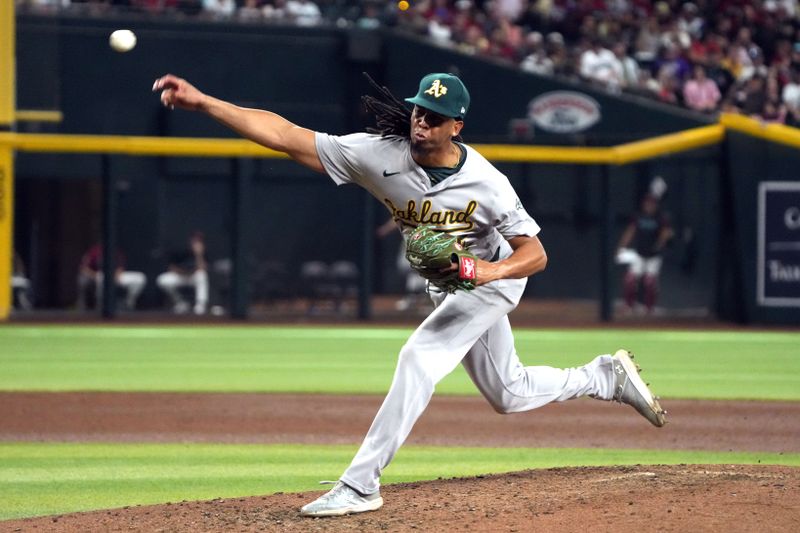 Jun 29, 2024; Phoenix, Arizona, USA; Oakland Athletics pitcher Osvaldo Bido (45) throws against the Arizona Diamondbacks in the eighth inning at Chase Field. Mandatory Credit: Rick Scuteri-USA TODAY Sports