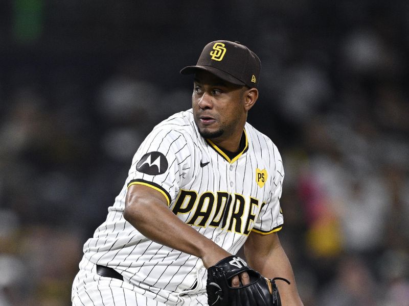 May 13, 2024; San Diego, California, USA; San Diego Padres relief pitcher Wandy Peralta (58) throws a pitch against the Colorado Rockies during the ninth inning at Petco Park. Mandatory Credit: Orlando Ramirez-USA TODAY Sports