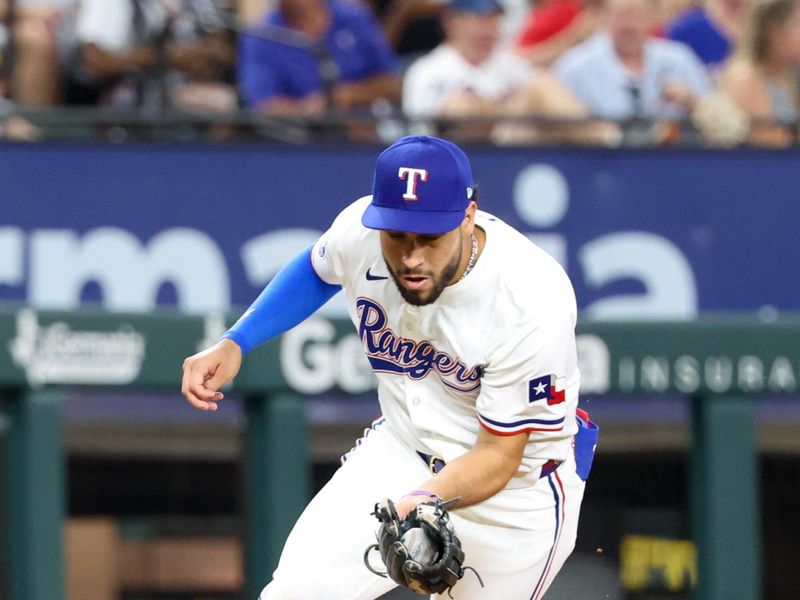 Jul 2, 2024; Arlington, Texas, USA;  Texas Rangers third baseman Jonathan Ornelas (21) fields a ground ball during the sixth inning against the San Diego Padres at Globe Life Field. Mandatory Credit: Kevin Jairaj-USA TODAY Sports