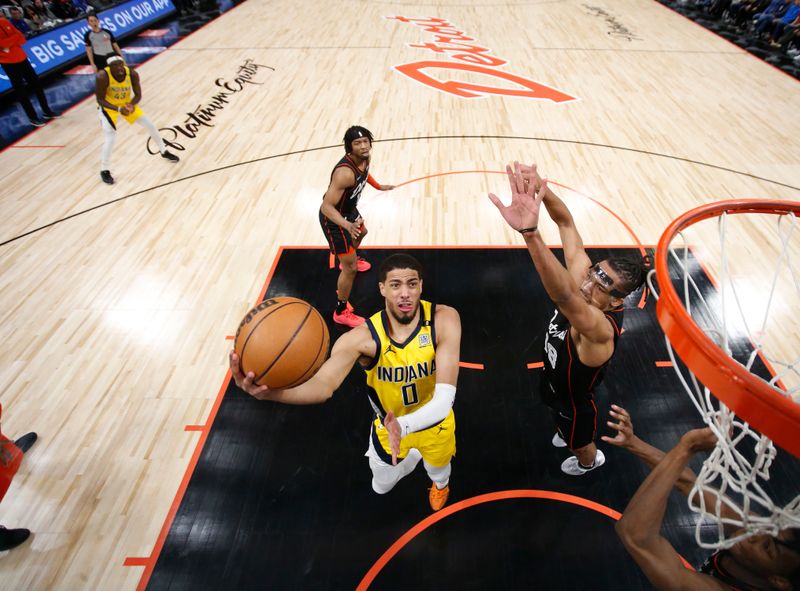 DETROIT, MI - MARCH 20: Tyrese Haliburton #0 of the Indiana Pacers drives to the basket during the game against the Detroit Pistons on March 20, 2024 at Little Caesars Arena in Detroit, Michigan. NOTE TO USER: User expressly acknowledges and agrees that, by downloading and/or using this photograph, User is consenting to the terms and conditions of the Getty Images License Agreement. Mandatory Copyright Notice: Copyright 2024 NBAE (Photo by Brian Sevald/NBAE via Getty Images)