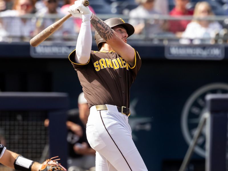 Mar 11, 2025; Peoria, Arizona, USA; San Diego Padres outfielder Jackson Merrill hits a home run against the Chicago White Sox during a spring training game at Peoria Sports Complex. Mandatory Credit: Mark J. Rebilas-Imagn Images