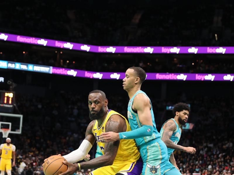 CHARLOTTE, NC - FEBRUARY 5: LeBron James #23 of the Los Angeles Lakers handles the ball during the game against the Charlotte Hornets on February 5, 2024 at Spectrum Center in Charlotte, North Carolina. NOTE TO USER: User expressly acknowledges and agrees that, by downloading and or using this photograph, User is consenting to the terms and conditions of the Getty Images License Agreement.  Mandatory Copyright Notice:  Copyright 2024 NBAE (Photo by Brock Williams-Smith/NBAE via Getty Images)