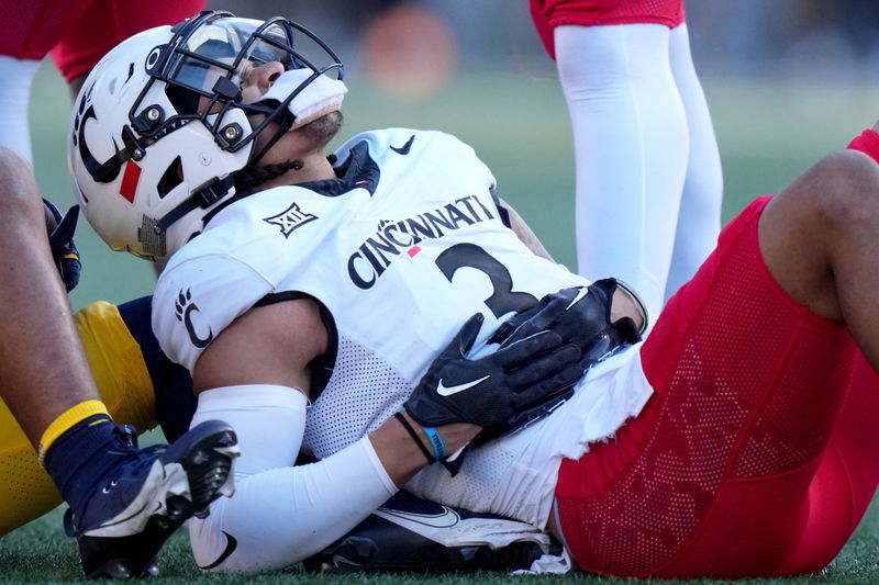 Nov 18, 2023; Morgantown, West Virginia, USA; Cincinnati Bearcats safety Deshawn Pace (3) reacts after suffering an apparent injury in the first quarter against the West Virginia Mountaineers at Milan Puskar Stadium.  Mandatory Credit: Kareem Elgazzar-USA TODAY Sports