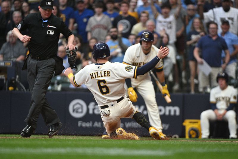 May 23, 2023; Milwaukee, Wisconsin, USA; Milwaukee Brewers second baseman Owen Miller (6) slides in safely for a run against the Houston Astros in the fourth inning at American Family Field. Mandatory Credit: Michael McLoone-USA TODAY Sports