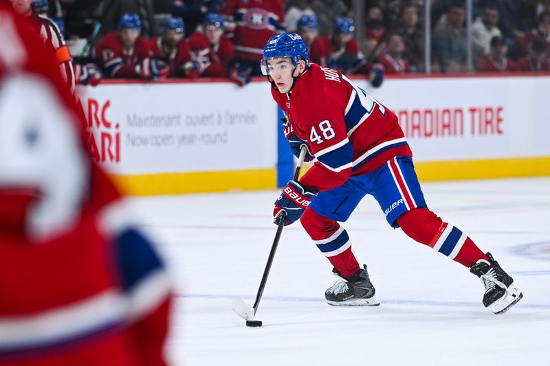 Oct 4, 2025; Montreal, Quebec, CAN; Montreal Canadiens defenseman Lane Hutson (48) plays the puck against the Ottawa Senators during the third period at Bell Centre. Mandatory Credit: David Kirouac-Imagn Images