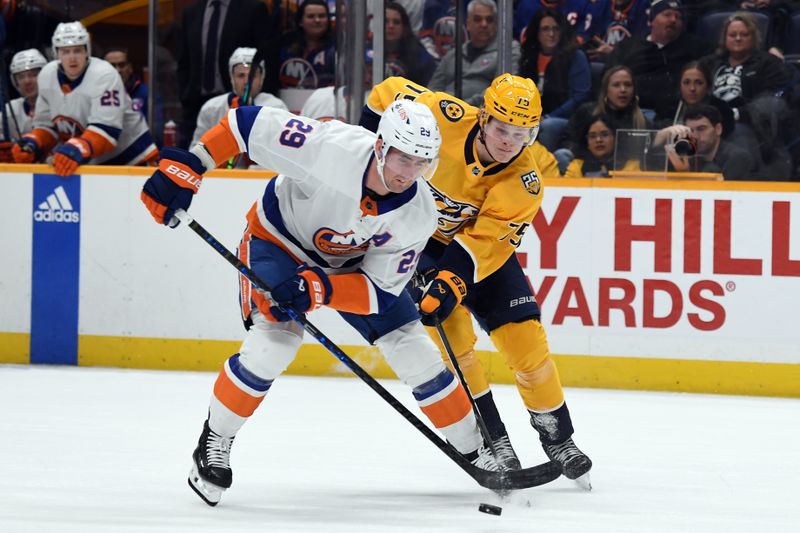 Jan 13, 2024; Nashville, Tennessee, USA; New York Islanders center Brock Nelson (29) takes the puck from Nashville Predators center Juuso Parssinen (75) during the first period at Bridgestone Arena. Mandatory Credit: Christopher Hanewinckel-USA TODAY Sports