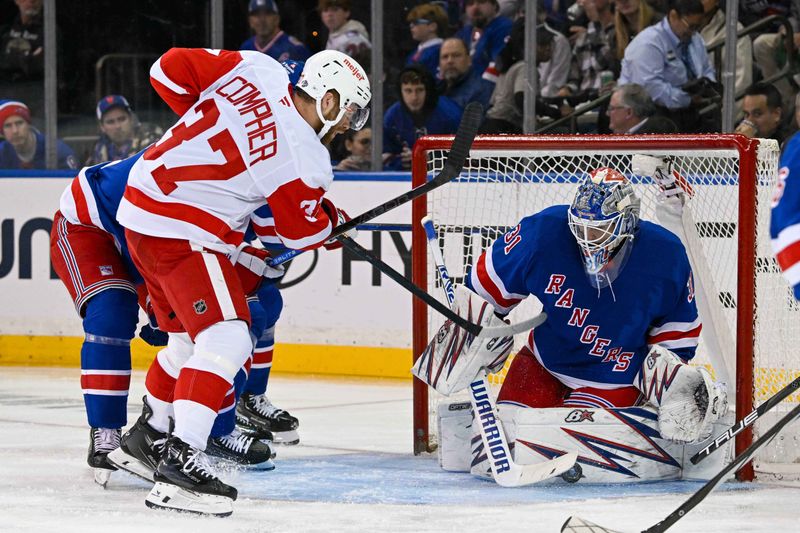 Oct 14, 2024; New York, New York, USA;  New York Rangers goaltender Igor Shesterkin (31) makes a save on Detroit Red Wings left wing J.T. Compher (37) during the second period at Madison Square Garden. Mandatory Credit: Dennis Schneidler-Imagn Images