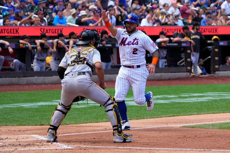 Aug 16, 2023; New York City, New York, USA; New York Mets catcher Omar Narvaez (2) scores a run on New York Mets shortstop Francisco Lindor (not pictured) RBI double against the Pittsburgh Pirates during the second inning at Citi Field. Mandatory Credit: Gregory Fisher-USA TODAY Sports