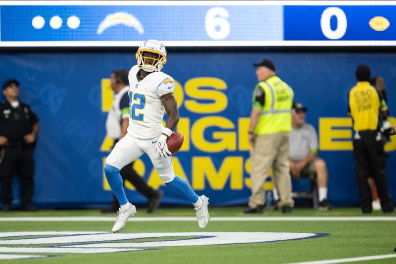 Los Angeles Chargers wide receiver Derius Davis (12) reacts after scoring a touchdown on a punt return during the first half of an NFL preseason football game against the Los Angeles Rams, Saturday, Aug. 12, 2023, in Inglewood, Calif. (AP Photo/Kyusung Gong)