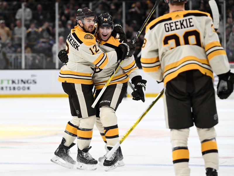 Mar 21, 2024; Boston, Massachusetts, USA; Boston Bruins left wing Jake DeBrusk (74) celebrates with defenseman Kevin Shattenkirk (12) and center Morgan Geekie (39) after scoring a goal against the New York Rangers during the first period at the TD Garden. Mandatory Credit: Brian Fluharty-USA TODAY Sports