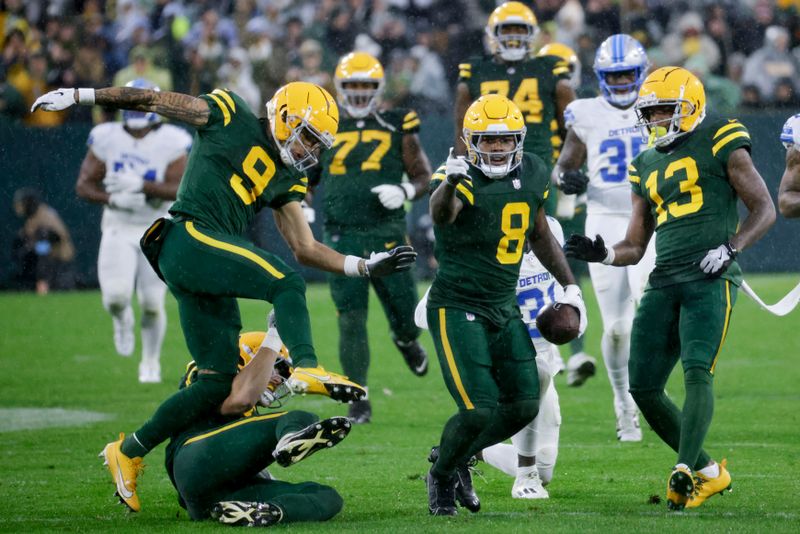 Green Bay Packers running back Josh Jacobs (8) celebrates after a first down during the first half of an NFL football game against the Detroit Lions, Sunday, Nov. 3, 2024, in Green Bay, Wis. (AP Photo/Mike Roemer)