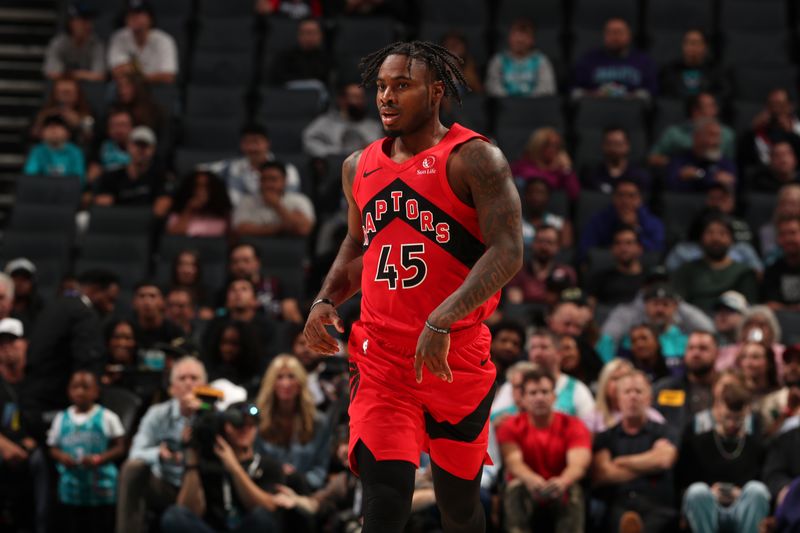 CHARLOTTE, NC - OCTOBER 30: Davion Mitchell #45 of the Toronto Raptors looks on during the game against the Charlotte Hornets on October 30, 2024 at Spectrum Center in Charlotte, North Carolina. NOTE TO USER: User expressly acknowledges and agrees that, by downloading and or using this photograph, User is consenting to the terms and conditions of the Getty Images License Agreement. Mandatory Copyright Notice: Copyright 2024 NBAE (Photo by Kent Smith/NBAE via Getty Images)