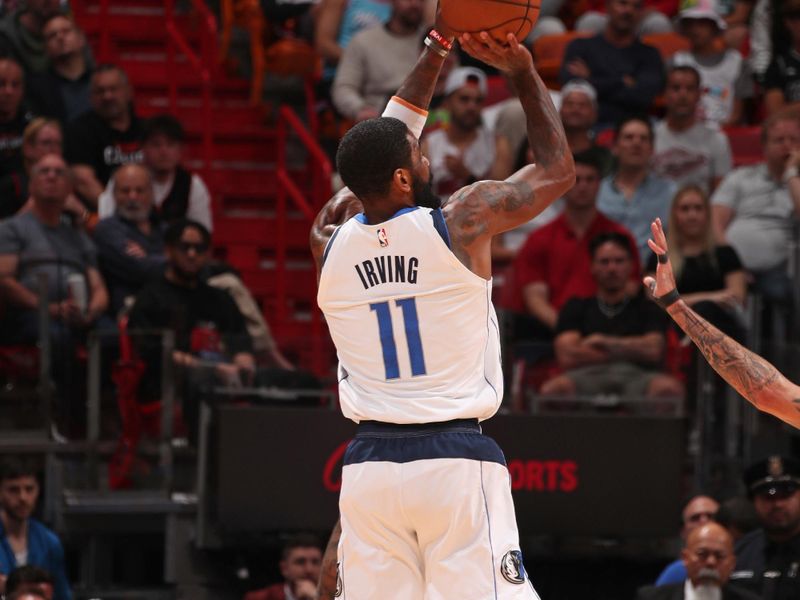 MIAMI, FL - APRIL 10: Kyrie Irving #11 of the Dallas Mavericks shoots the ball during the game against the Miami Heat on April 10, 2024 at Kaseya Center in Miami, Florida. NOTE TO USER: User expressly acknowledges and agrees that, by downloading and or using this Photograph, user is consenting to the terms and conditions of the Getty Images License Agreement. Mandatory Copyright Notice: Copyright 2024 NBAE (Photo by Issac Baldizon/NBAE via Getty Images)