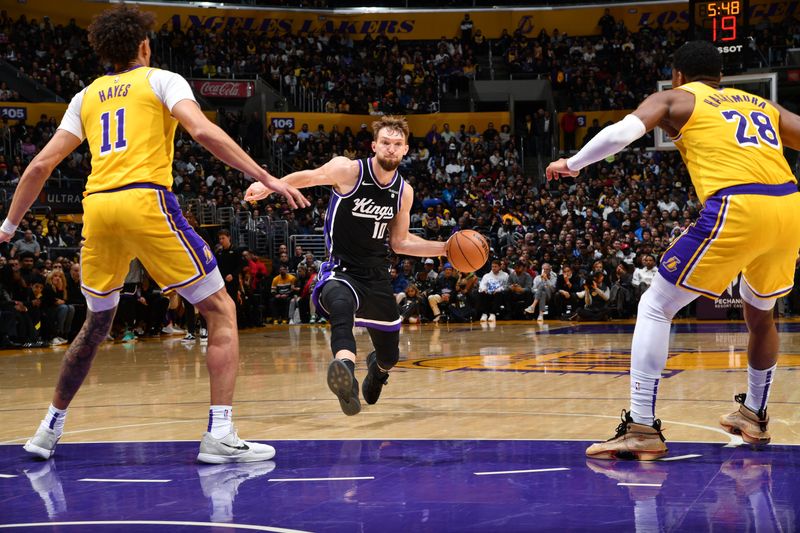 LOS ANGELES, CA - MARCH 6: Domantas Sabonis #10 of the Sacramento Kings drives to the basket during the game against the Los Angeles Lakers on March 6, 2024 NBAE at Crypto.Com Arena in Los Angeles, California. NOTE TO USER: User expressly acknowledges and agrees that, by downloading and/or using this Photograph, user is consenting to the terms and conditions of the Getty Images License Agreement. Mandatory Copyright Notice: Copyright 2024 NBAE (Photo by Juan Ocampo/NBAE via Getty Images)