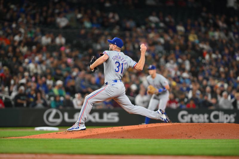 Sep 14, 2024; Seattle, Washington, USA; Texas Rangers starting pitcher Max Scherzer (31) pitches to the Seattle Mariners during the first inning at T-Mobile Park. Mandatory Credit: Steven Bisig-Imagn Images