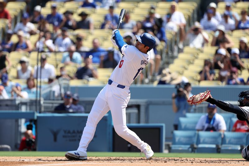 Sep 8, 2024; Los Angeles, California, USA;  Los Angeles Dodgers designated hitter Shohei Ohtani (17) hits a single during the third inning against the Cleveland Guardians at Dodger Stadium. Mandatory Credit: Kiyoshi Mio-Imagn Images