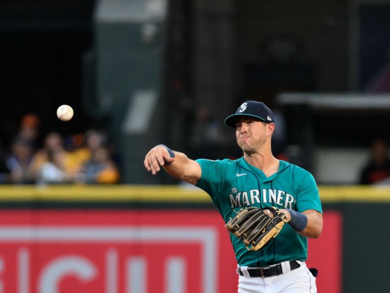 Aug 12, 2023; Seattle, Washington, USA; Seattle Mariners shortstop Dylan Moore (25) throws to first base for the force out on Baltimore Orioles third baseman Jordan Westburg (11) (not pictured) during the sixth inning at T-Mobile Park. Mandatory Credit: Steven Bisig-USA TODAY Sports