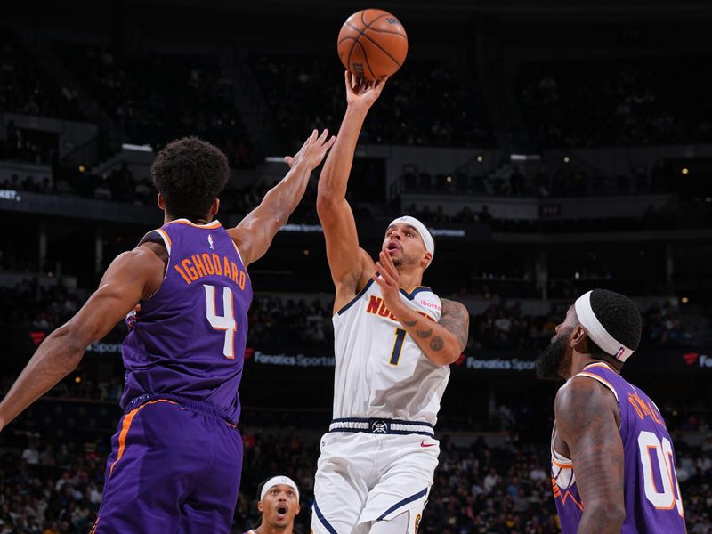 DENVER, CO - OCTOBER 13: Michael Porter Jr. #1 of the Denver Nuggets drives to the basket during the game against the Phoenix Suns on October 13, 2024 at Ball Arena in Denver, Colorado. NOTE TO USER: User expressly acknowledges and agrees that, by downloading and/or using this Photograph, user is consenting to the terms and conditions of the Getty Images License Agreement. Mandatory Copyright Notice: Copyright 2024 NBAE (Photo by Garrett Ellwood/NBAE via Getty Images)