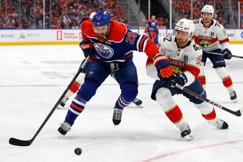 Jun 4, 2025; Edmonton, Alberta, CAN; Edmonton Oilers center Leon Draisaitl (29) skates with the puck past Florida Panthers defenseman Gustav Forsling (42) during the first period in game one of the 2025 Stanley Cup Final at Rogers Place. Mandatory Credit: Perry Nelson-Imagn Images