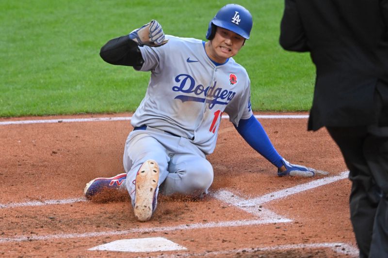 May 26, 2025; Cleveland, Ohio, USA; Los Angeles Dodgers designated hitter Shohei Ohtani (17) scores in the fifth inning against the Cleveland Guardians at Progressive Field. Mandatory Credit: David Richard-Imagn Images