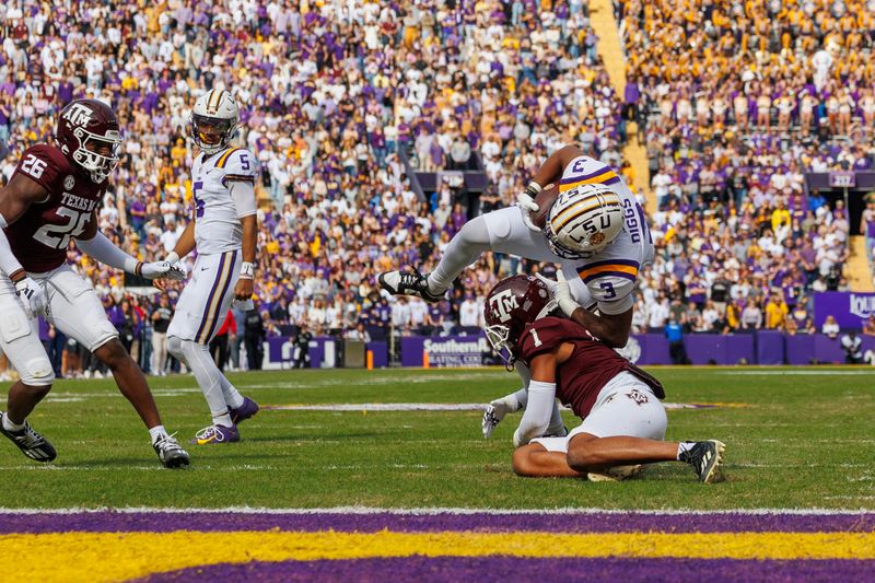 Nov 25, 2023; Baton Rouge, Louisiana, USA;  Texas A&M Aggies defensive back Bryce Anderson (1) tackles LSU Tigers running back Logan Diggs (3) during the first half at Tiger Stadium. Mandatory Credit: Stephen Lew-USA TODAY Sports