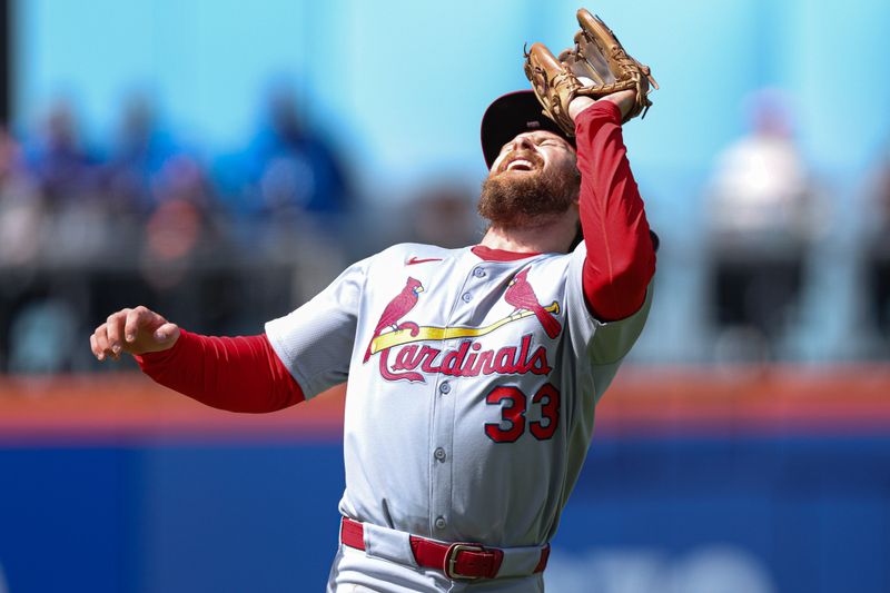 Apr 20, 2025; New York City, New York, USA; St. Louis Cardinals second baseman Brendan Donovan (33) makes a catch for an out during the fourth inning against the New York Mets at Citi Field. Mandatory Credit: Vincent Carchietta-Imagn Images
