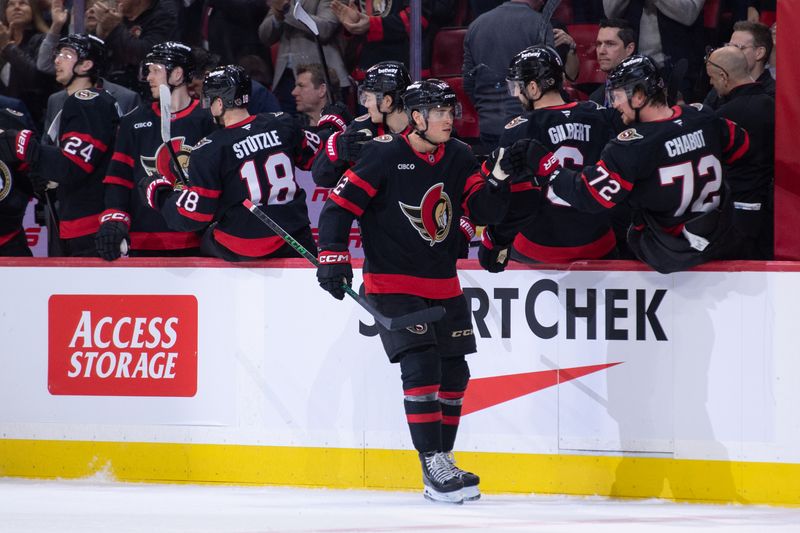 Mar 19, 2026; Ottawa, Ontario, CAN; Ottawa Senators center Shane Pinto (12) celebrates with team his goal scored in the second period against the New York Islanders at the Canadian Tire Centre. Mandatory Credit: Marc DesRosiers-IMAGN Images