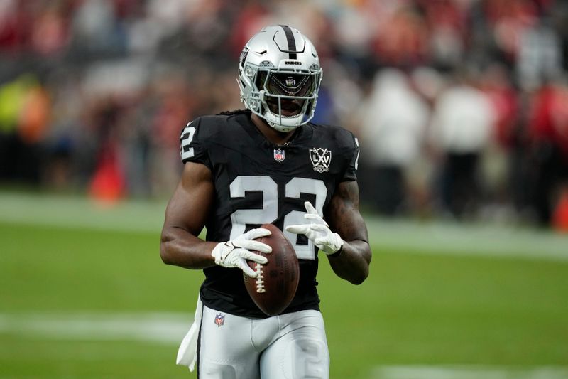 Las Vegas Raiders running back Alexander Mattison warms up before an NFL football game between the Kansas City Chiefs and Las Vegas Raiders Sunday, Oct. 27, 2024, in Las Vegas. (AP Photo/John Locher)