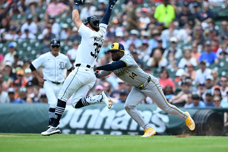 Jun 9, 2024; Detroit, Michigan, USA;  Milwaukee Brewers second base Andruw Monasterio (14) tags out Detroit Tigers shortstop Zach McKinstry (39) on the first base line in the first inning at Comerica Park. Mandatory Credit: Lon Horwedel-USA TODAY Sports