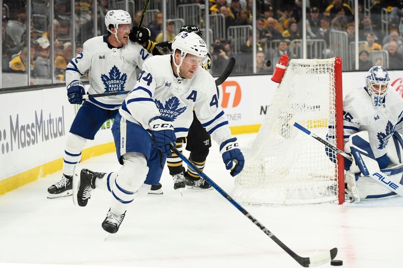 Apr 20, 2024; Boston, Massachusetts, USA; Toronto Maple Leafs defenseman Morgan Rielly (44) skates with the puck during the first period in game one of the first round of the 2024 Stanley Cup Playoffs against the Boston Bruins at TD Garden. Mandatory Credit: Bob DeChiara-USA TODAY Sports