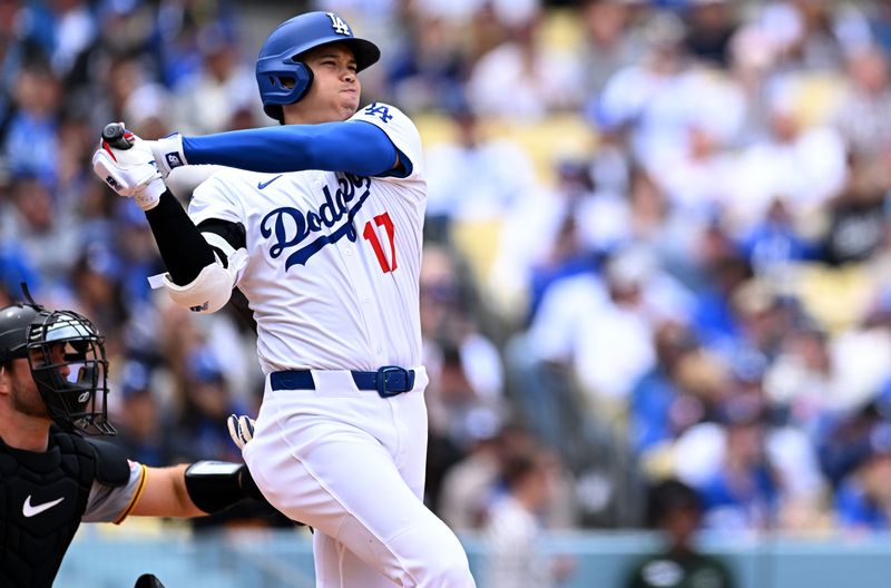 Apr 27, 2025; Los Angeles, California, USA; Los Angeles Dodgers designated hitter Shohei Ohtani (17) doubles during the second inning against the Pittsburgh Pirates at Dodger Stadium. Mandatory Credit: Jonathan Hui-Imagn Images