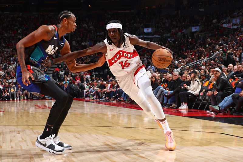 TORONTO, CANADA - MARCH 25: Mouhamadou Gueye #16 of the Toronto Raptors handles the ball during the game against the Brooklyn Nets on March 25, 2024 at the Scotiabank Arena in Toronto, Ontario, Canada.  NOTE TO USER: User expressly acknowledges and agrees that, by downloading and or using this Photograph, user is consenting to the terms and conditions of the Getty Images License Agreement.  Mandatory Copyright Notice: Copyright 2024 NBAE (Photo by Vaughn Ridley/NBAE via Getty Images)