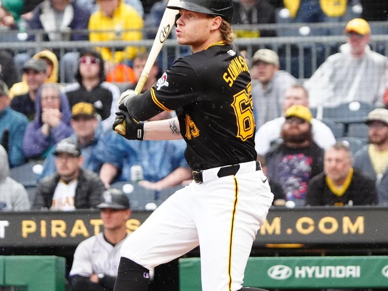 May 4, 2024; Pittsburgh, Pennsylvania, USA; Pittsburgh Pirates left fielder Jack Suwinski (65) hits a walk off RBI single against the Colorado Rockies during the ninth inning at PNC Park. Mandatory Credit: Gregory Fisher-USA TODAY Sports