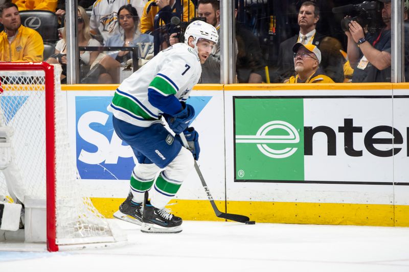 May 3, 2024; Nashville, Tennessee, USA; Vancouver Canucks defenseman Carson Soucy (7) skates with the puck against the Nashville Predators during the third period in game six of the first round of the 2024 Stanley Cup Playoffs at Bridgestone Arena. Mandatory Credit: Steve Roberts-USA TODAY Sports