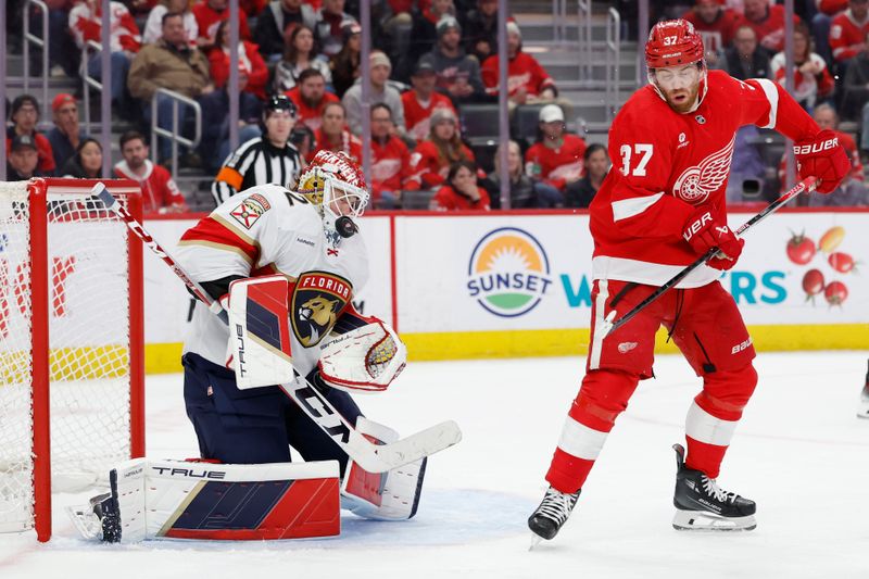 Mar 2, 2024; Detroit, Michigan, USA; Florida Panthers goaltender Sergei Bobrovsky (72) makes a save in front of Detroit Red Wings left wing J.T. Compher (37) in the second period at Little Caesars Arena. Mandatory Credit: Rick Osentoski-USA TODAY Sports