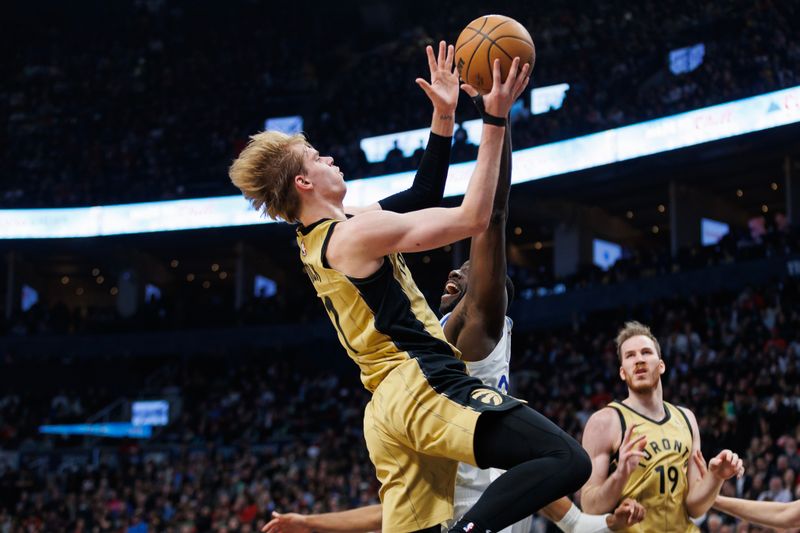 TORONTO, CANADA - MARCH 1: Gradey Dick #1 of the Toronto Raptors drives to the net against Draymond Green #23 of the Golden State Warriors in the first half of their NBA game at Scotiabank Arena on March 1, 2024 in Toronto, Canada.  NOTE TO USER: User expressly acknowledges and agrees that, by downloading and or using this photograph, User is consenting to the terms and conditions of the Getty Images License Agreement. (Photo by Cole Burston/Getty Images)