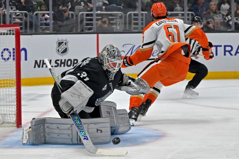 Dec 27, 2025; Los Angeles, California, USA; Los Angeles Kings goaltender Anton Forsberg (31) stops a shot by Anaheim Ducks left wing Cutter Gauthier (61) in the first period at Crypto.com Arena. Mandatory Credit: Jayne Kamin-Oncea-Imagn Images