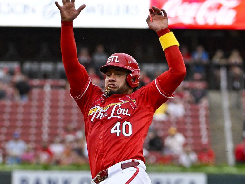 Aug 7, 2024; St. Louis, Missouri, USA;  St. Louis Cardinals catcher Willson Contreras (40) slides in at third base during the first inning against the Tampa Bay Rays at Busch Stadium. Mandatory Credit: Jeff Curry-USA TODAY Sports