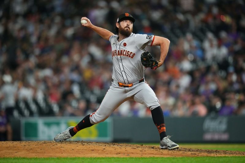 Jul 19, 2024; Denver, Colorado, USA; San Francisco Giants relief pitcher Ryan Walker (74) delivers a pitch in the seventh inning against the Colorado Rockies at Coors Field. Mandatory Credit: Ron Chenoy-USA TODAY Sports