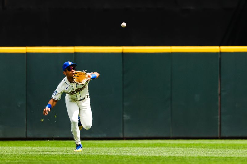 Jul 16, 2023; Seattle, Washington, USA; Seattle Mariners center fielder Julio Rodriguez (44) catches a fly ball against the Detroit Tigers during the first inning at T-Mobile Park. Mandatory Credit: Joe Nicholson-USA TODAY Sports