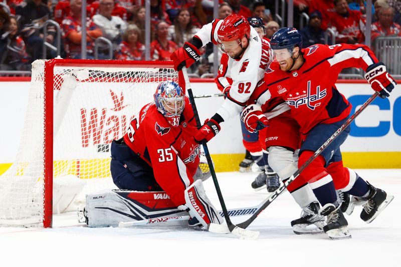 Mar 22, 2024; Washington, District of Columbia, USA; Washington Capitals goaltender Darcy Kuemper (35) makes a save against Carolina Hurricanes center Evgeny Kuznetsov (92) during the second period at Capital One Arena. Mandatory Credit: Amber Searls-USA TODAY Sports