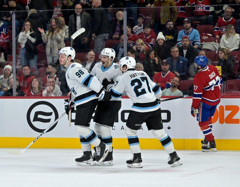 Nov 26, 2024; Montreal, Quebec, CAN; Utah Hockey Club defenseman Mikhail Sergachev (98) celebrates with teammates after scoring the winning goal against the Montreal Canadiens during the overtime period at the Bell Centre. Mandatory Credit: Eric Bolte-Imagn Images