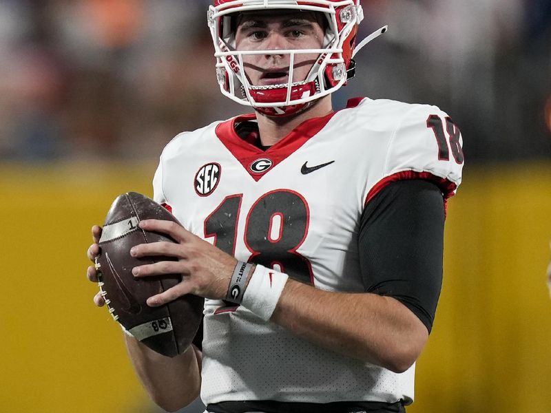 Sep 4, 2021; Charlotte, North Carolina, USA; Georgia Bulldogs quarterback JT Daniels (18) drops back to pass against the Clemson Tigers during the first quarter at Bank of America Stadium. Mandatory Credit: Jim Dedmon-USA TODAY Sports