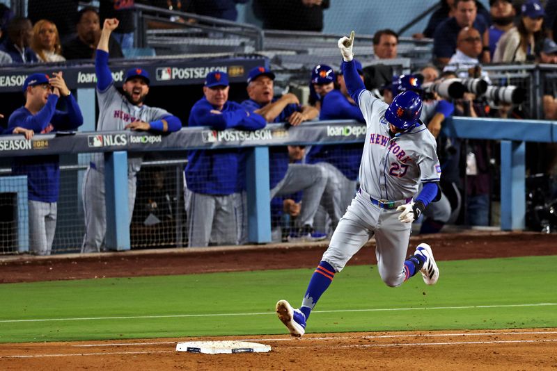 Oct 20, 2024; Los Angeles, California, USA; New York Mets third base Mark Vientos (27) celebrates after hitting a two run home run during the fourth inning against the Los Angeles Dodgers during game six of the NLCS for the 2024 MLB playoffs at Dodger Stadium. Mandatory Credit: Jason Parkhurst-Imagn Images