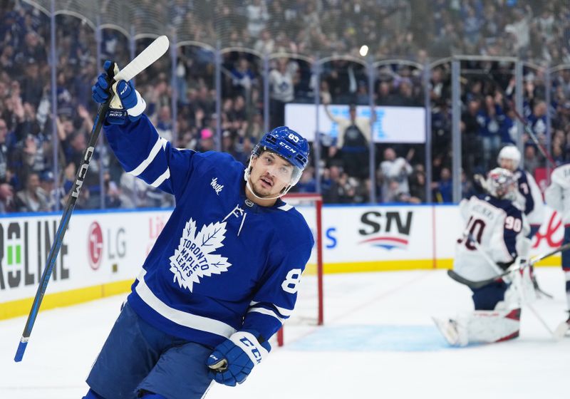 Apr 5, 2025; Toronto, Ontario, CAN; Toronto Maple Leafs left wing Nicholas Robertson (89) celebrates scoring a goal against the Columbus Blue Jackets during the first period at Scotiabank Arena. Mandatory Credit: Nick Turchiaro-Imagn Images