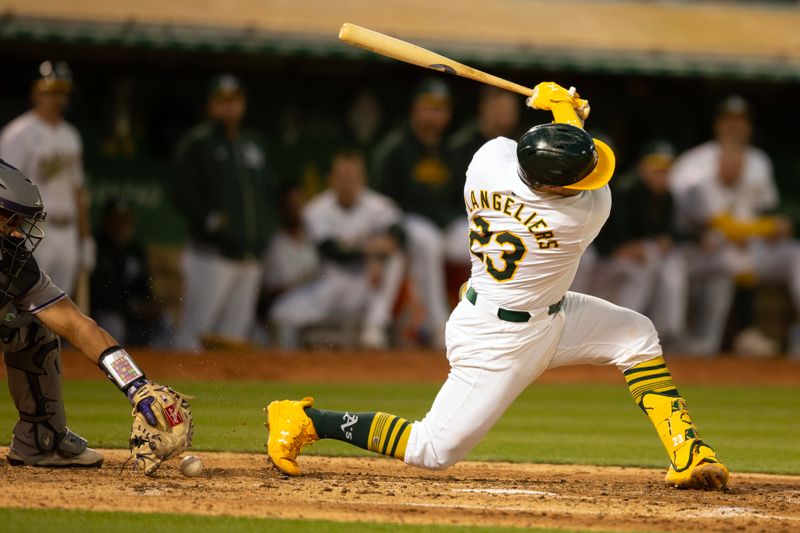 May 22, 2024; Oakland, California, USA; Oakland Athletics catcher Shea Langeliers (23) swings and misses for strike three against the Colorado Rockies during the seventh inning at Oakland-Alameda County Coliseum. Mandatory Credit: D. Ross Cameron-USA TODAY Sports